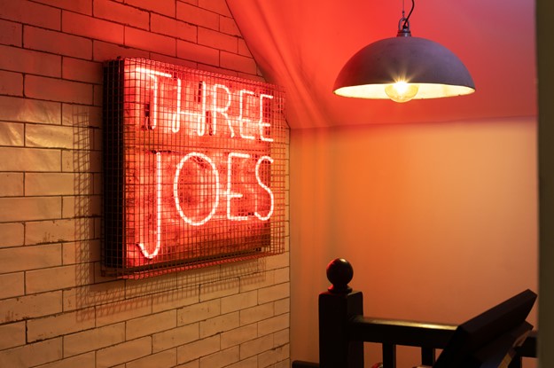 Neon sign at Three Joes